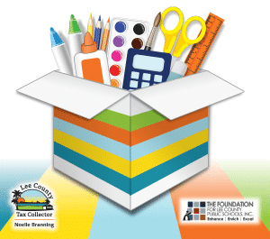 Cardboard box with blue, orange, green, and yellow stripes with school supplies inside.